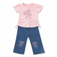 Little Minors girls butterfly charm set with pink T-shirt and denim pants, featuring playful butterfly details and casual style.
