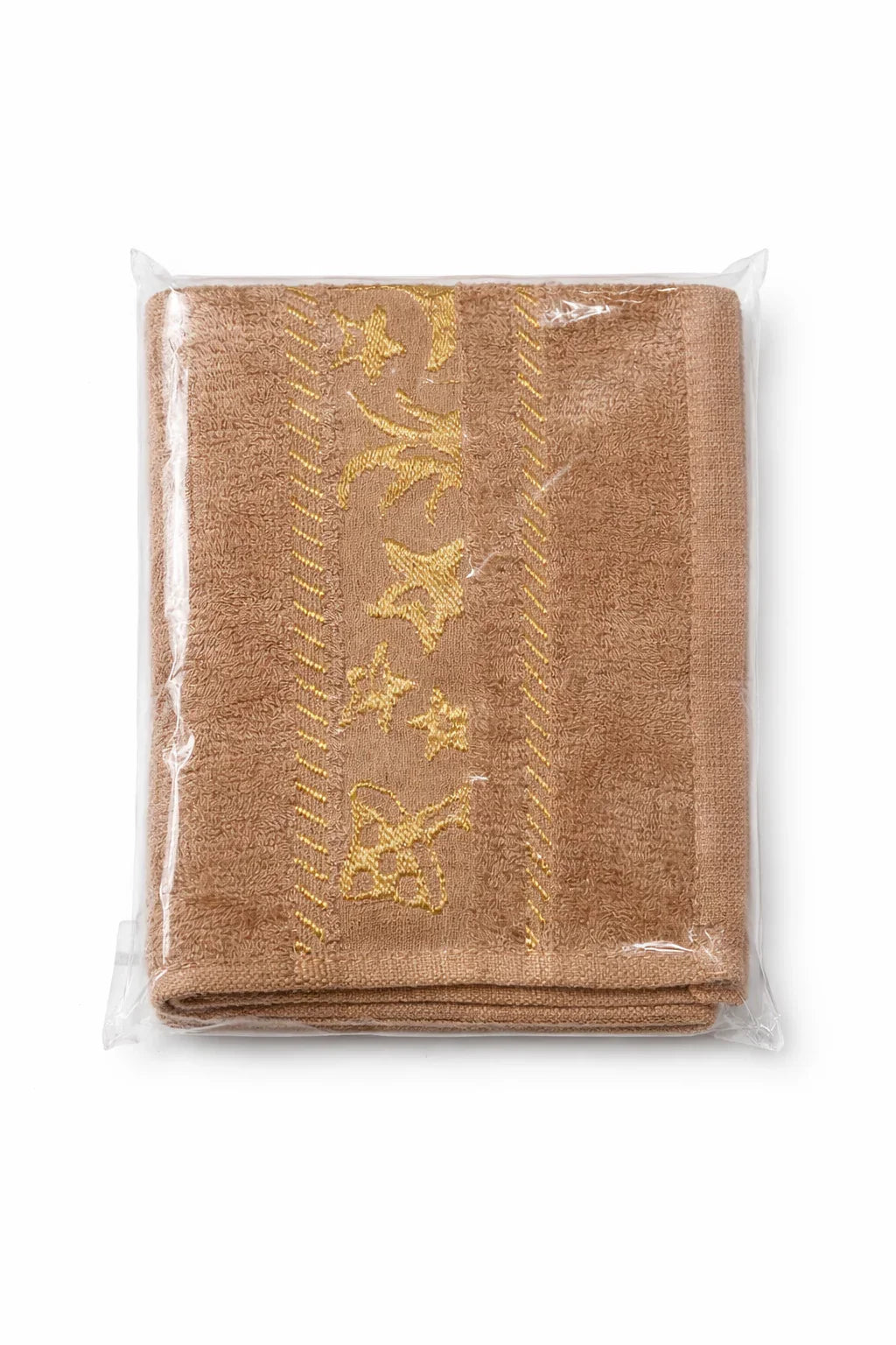 Folded brown baby towel with yellow embroidered stars and patterns, packaged in plastic. - hover image