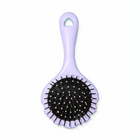 Little Minors baby hair brush with soft bristles, gentle scalp comb and grooming brush for kids' delicate hair and scalp.
