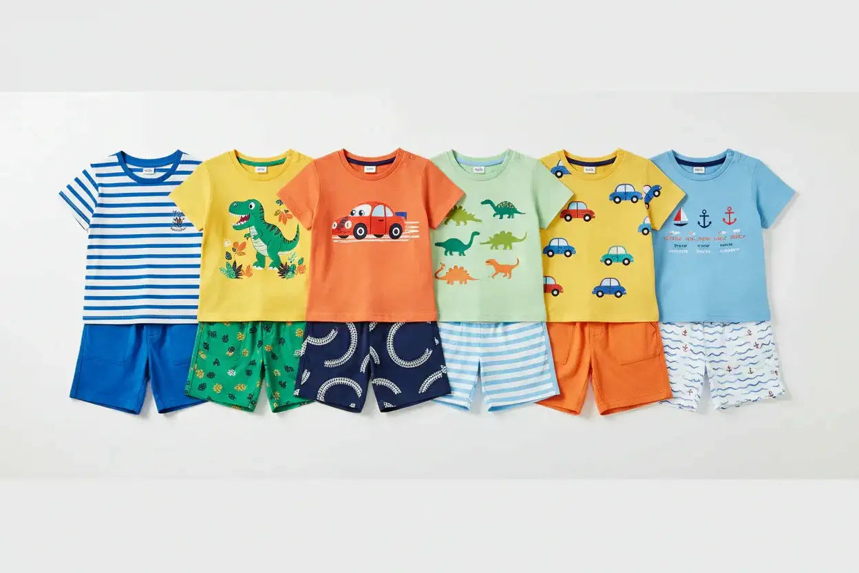 Variety of boys' summer t-shirt and shorts sets with dinosaur, car, and nautical prints