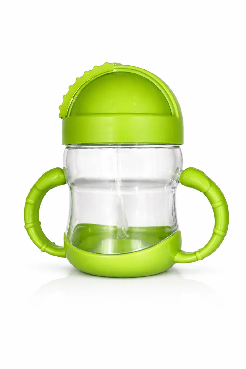 Green baby sippy cup with handles and spill-proof lid on white background