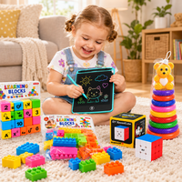 Baby playing with the Little Genius Bundle toys